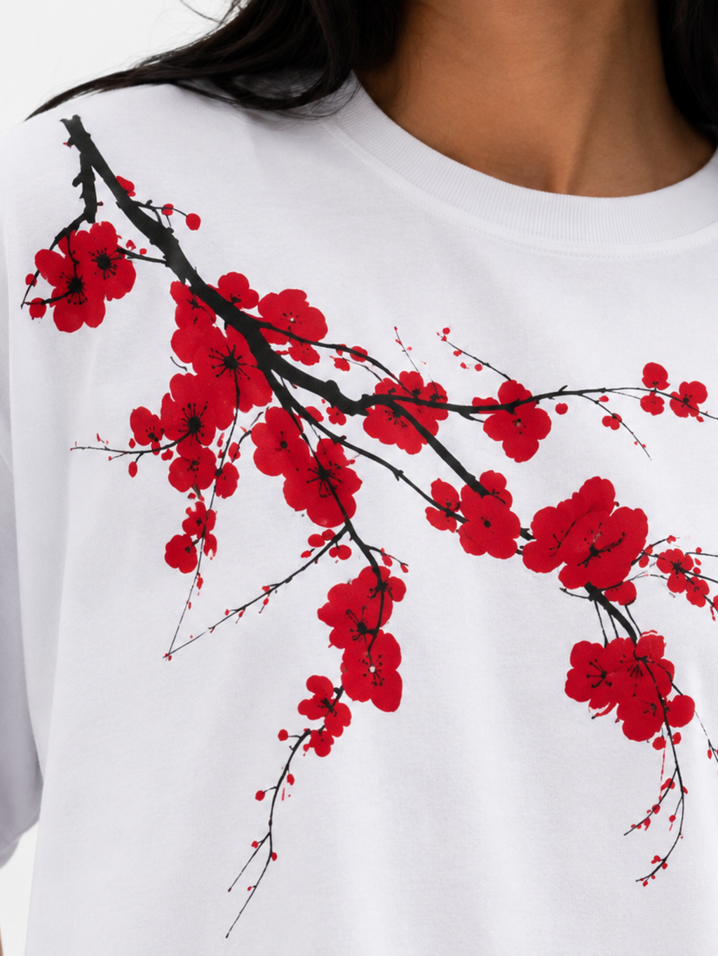 Close-up of Beauty Dies Too oversized t-shirt showcasing cherry blossom print and premium cotton fabric