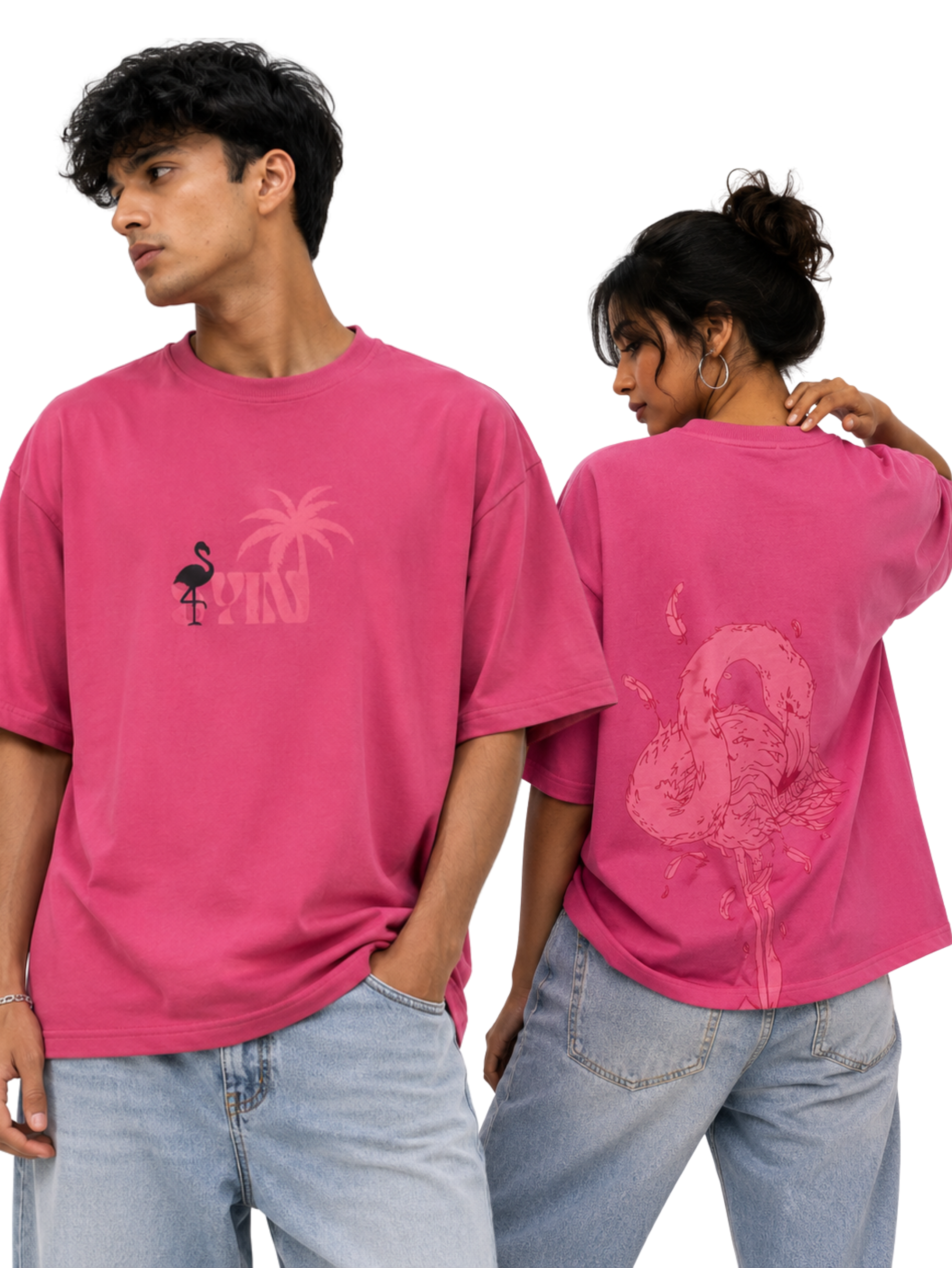 Male and female models showcasing Emerge in Pink oversized t-shirt featuring tropical front graphic and artistic flamingo back artwork