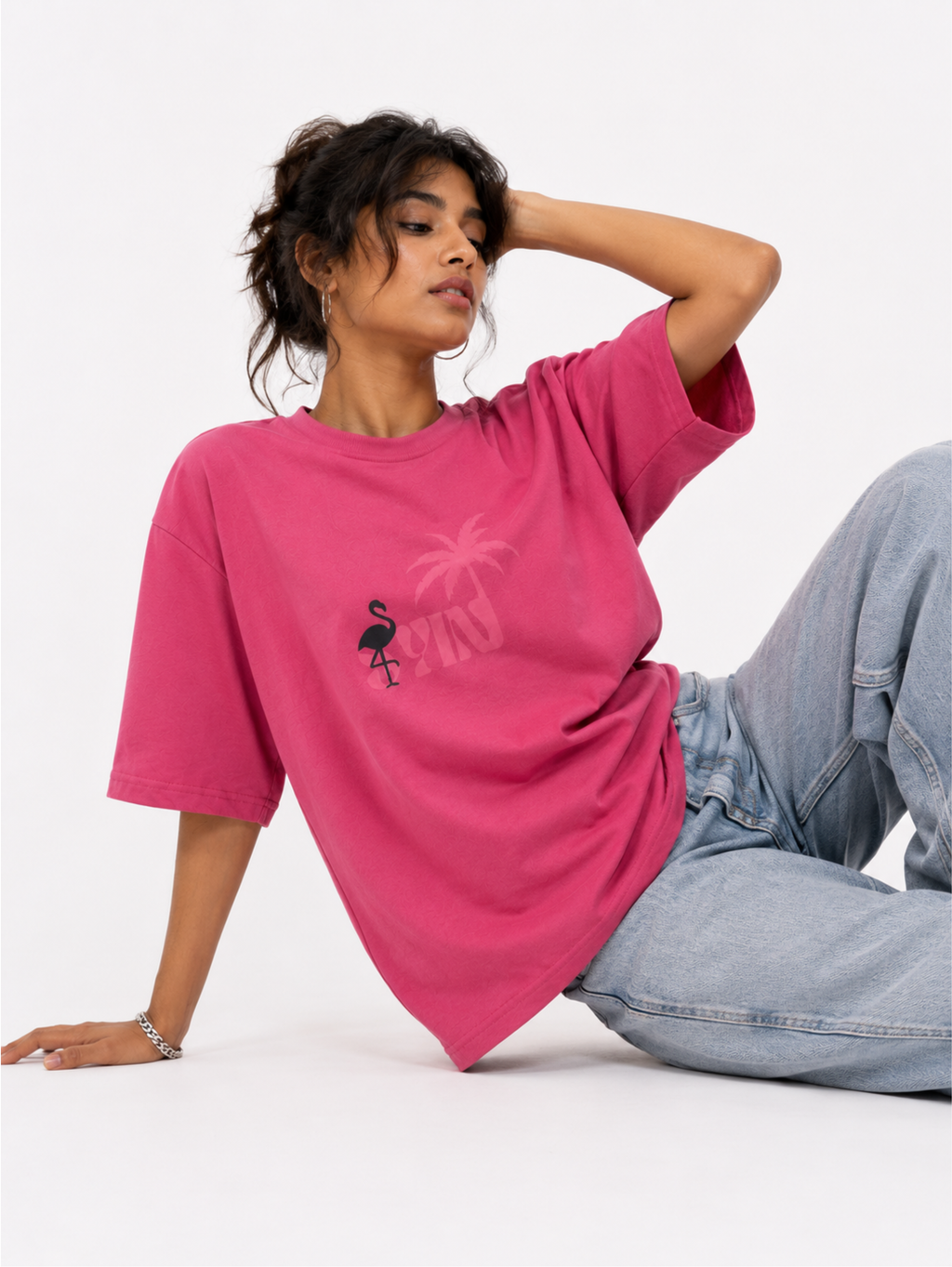 Female model wearing Emerge in Pink oversized pink heavyweight cotton t-shirt with relaxed streetwear styling