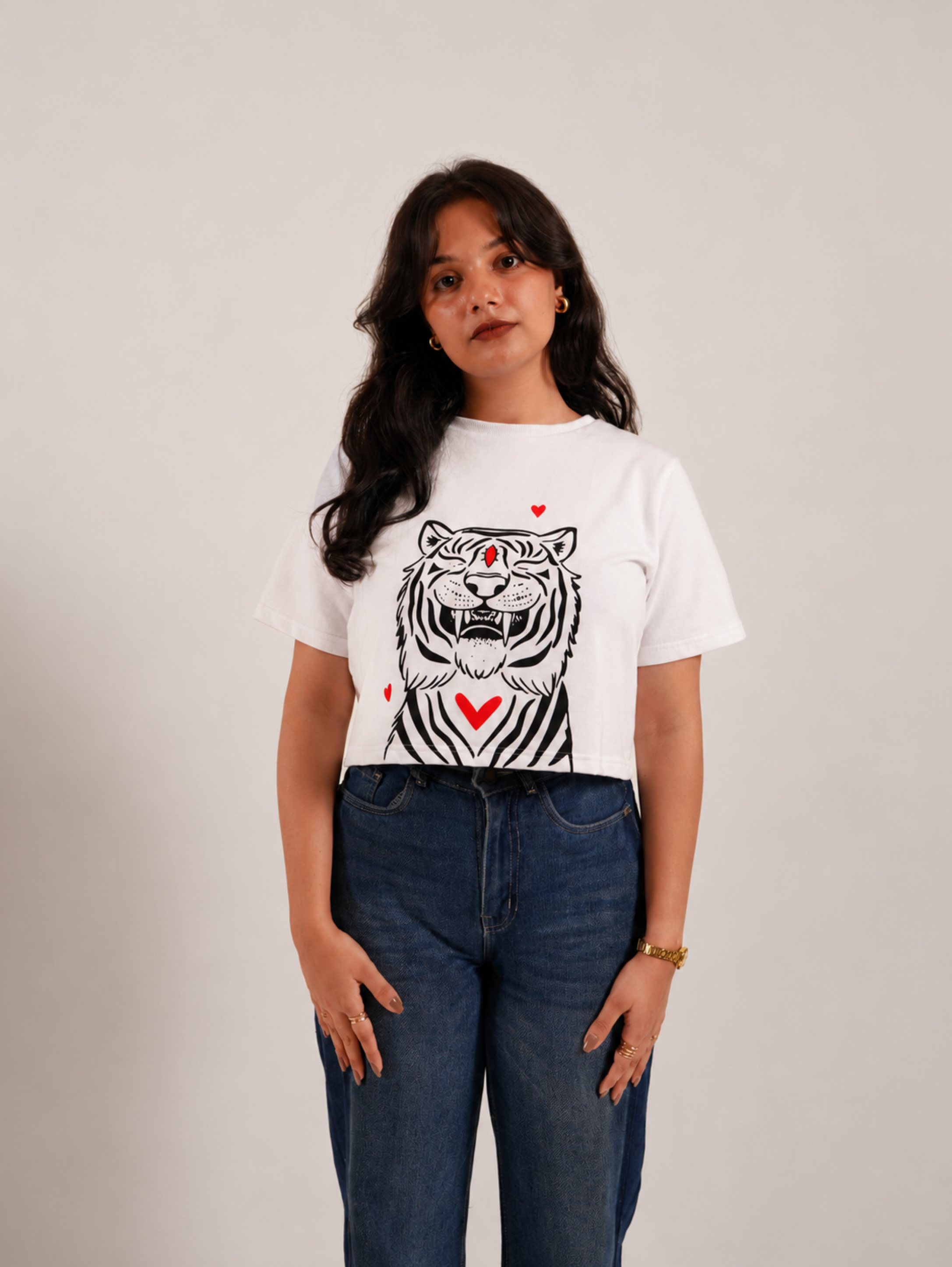 Female model showcasing Fierce & Fluffy premium white crop top