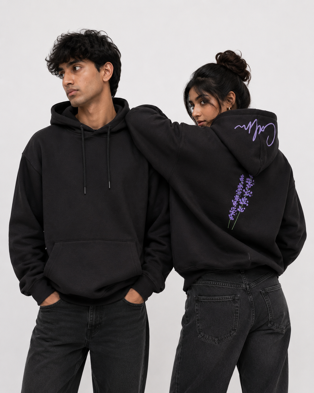 Front and back view of Midnight Lavender oversized black hoodie featuring lavender artwork and signature hood script.