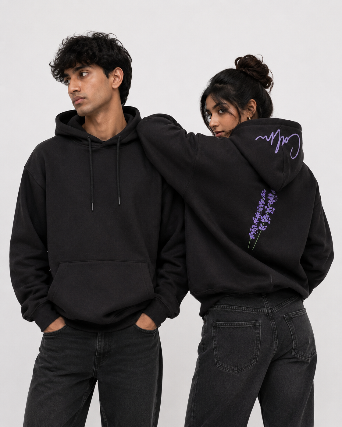 Front and back view of Midnight Lavender oversized black hoodie featuring lavender artwork and signature hood script.