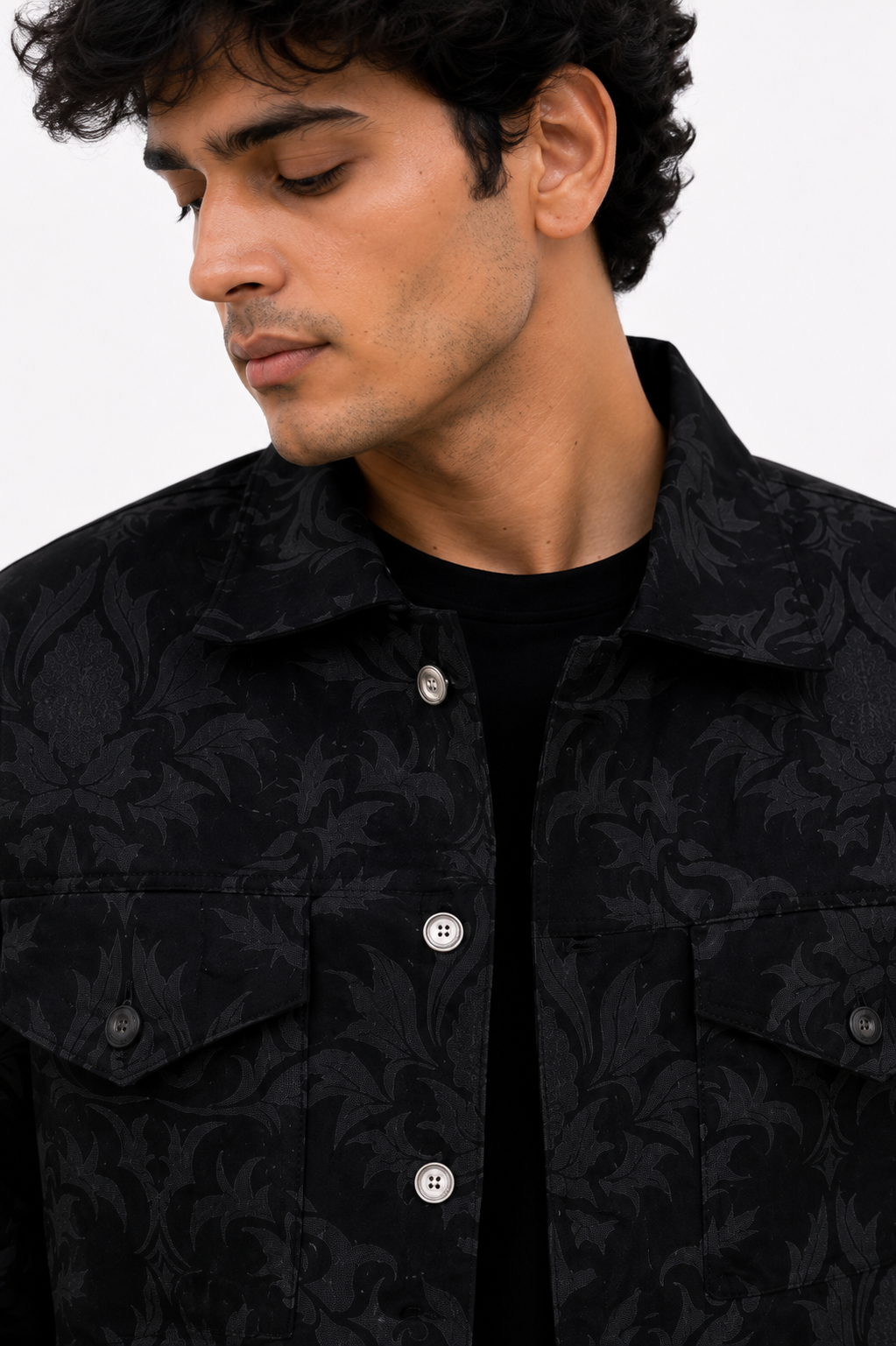 Close-up of the Moth Denim Jacket showcasing the premium black jacquard fabric with intricate tonal moth-inspired detailing and metal button closure.