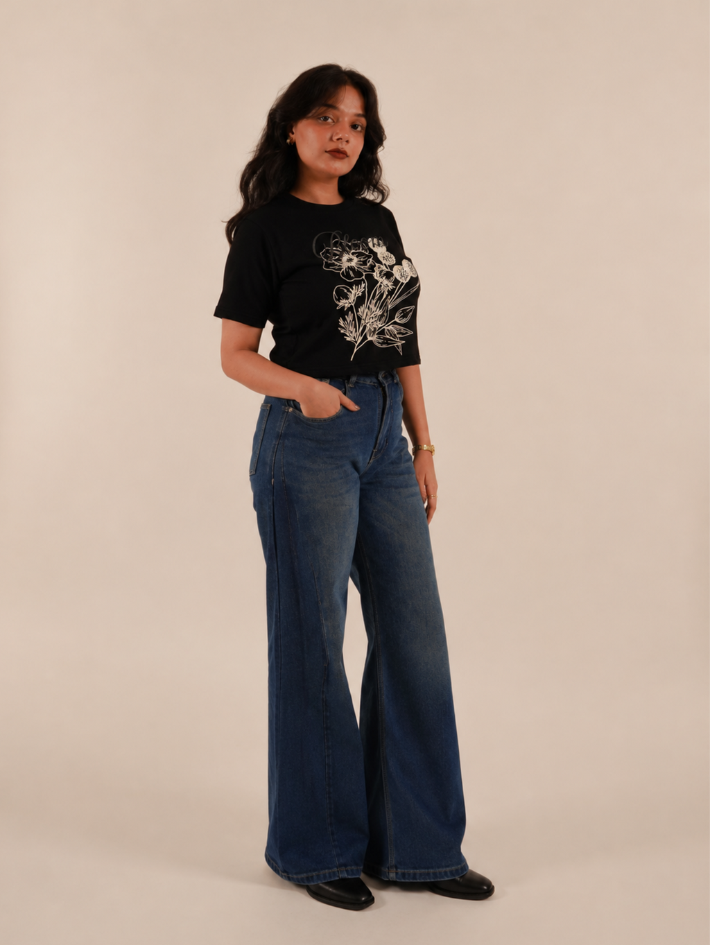 Female model showcasing Noir Bloom premium black floral crop top