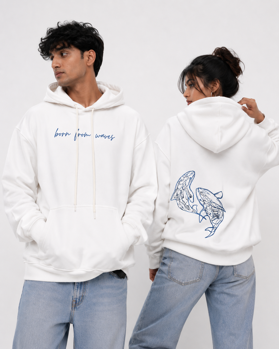 Front and back view of the Soul Born oversized white hoodie with "Born From Waves" front print and blue whale artwork on the back.
