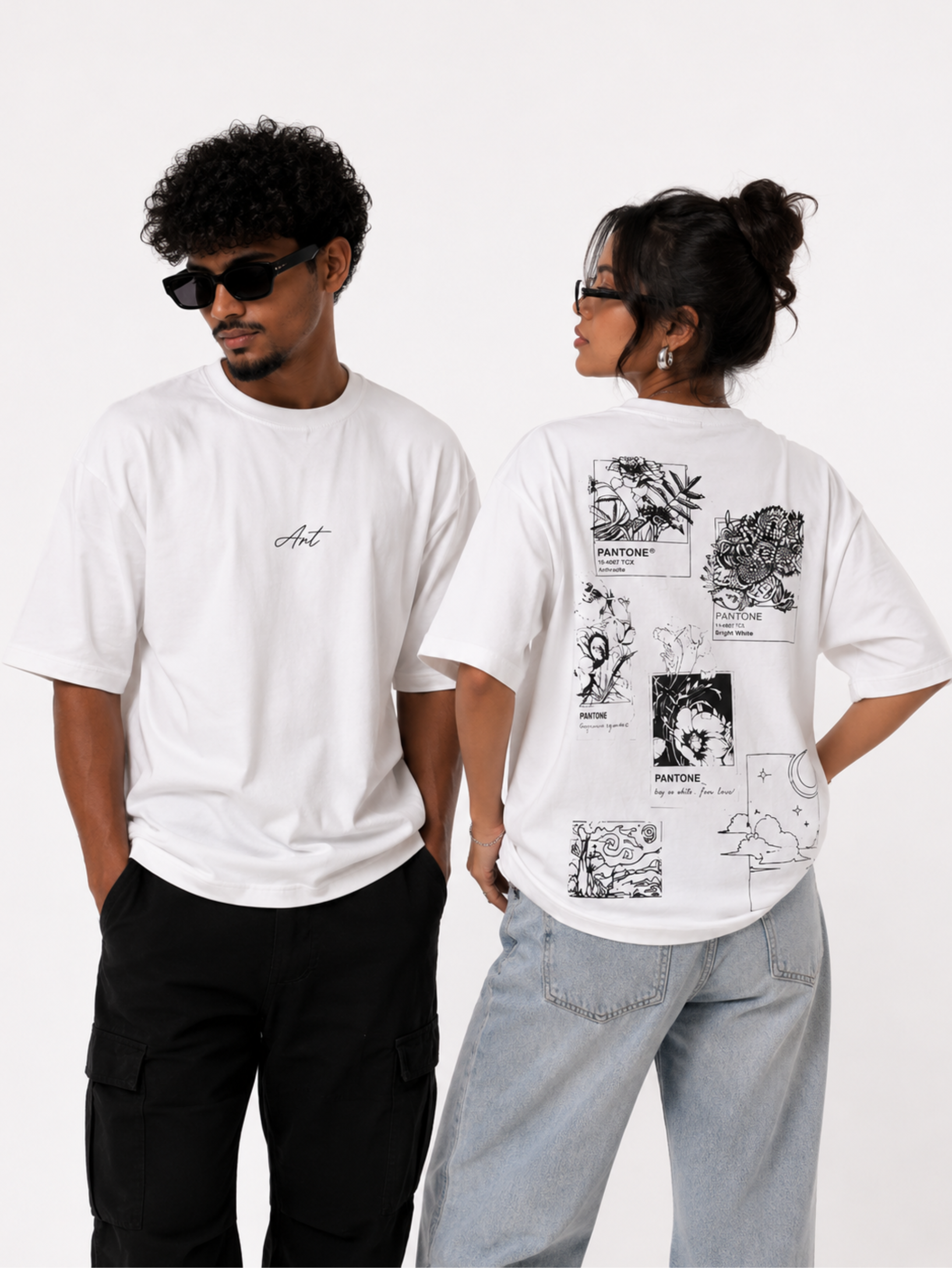 Male and female models wearing Undying Canvas oversized white graphic t-shirt showcasing minimalist front design and artistic collage back print
