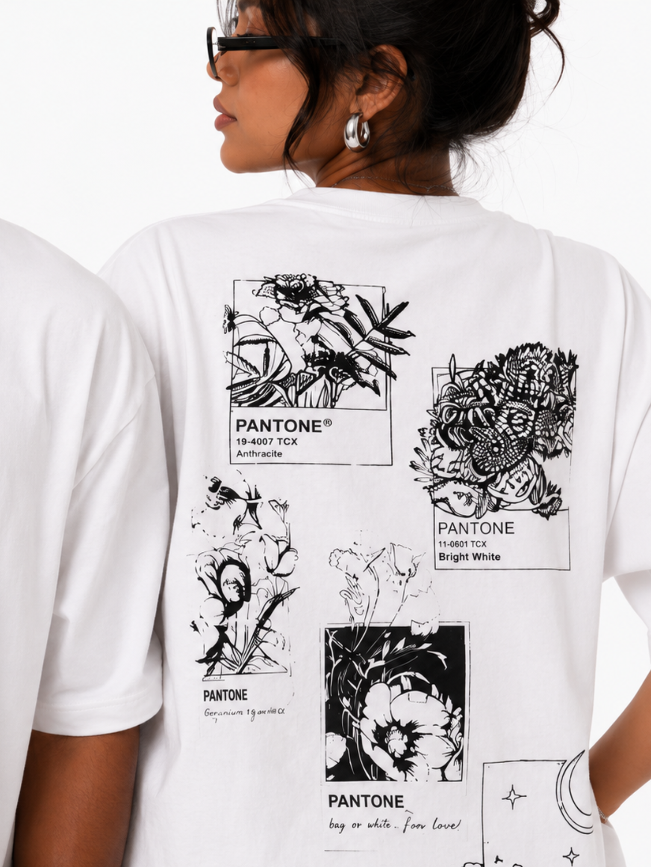 Close-up of Undying Canvas oversized white t-shirt highlighting handwritten Art typography and premium cotton fabric