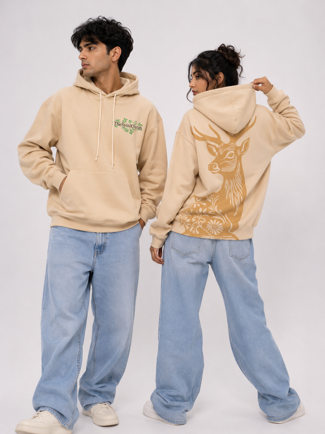 Front and back view of the Wild Grace oversized sand beige hoodie featuring the signature chest logo and large artistic deer illustration on the back.
