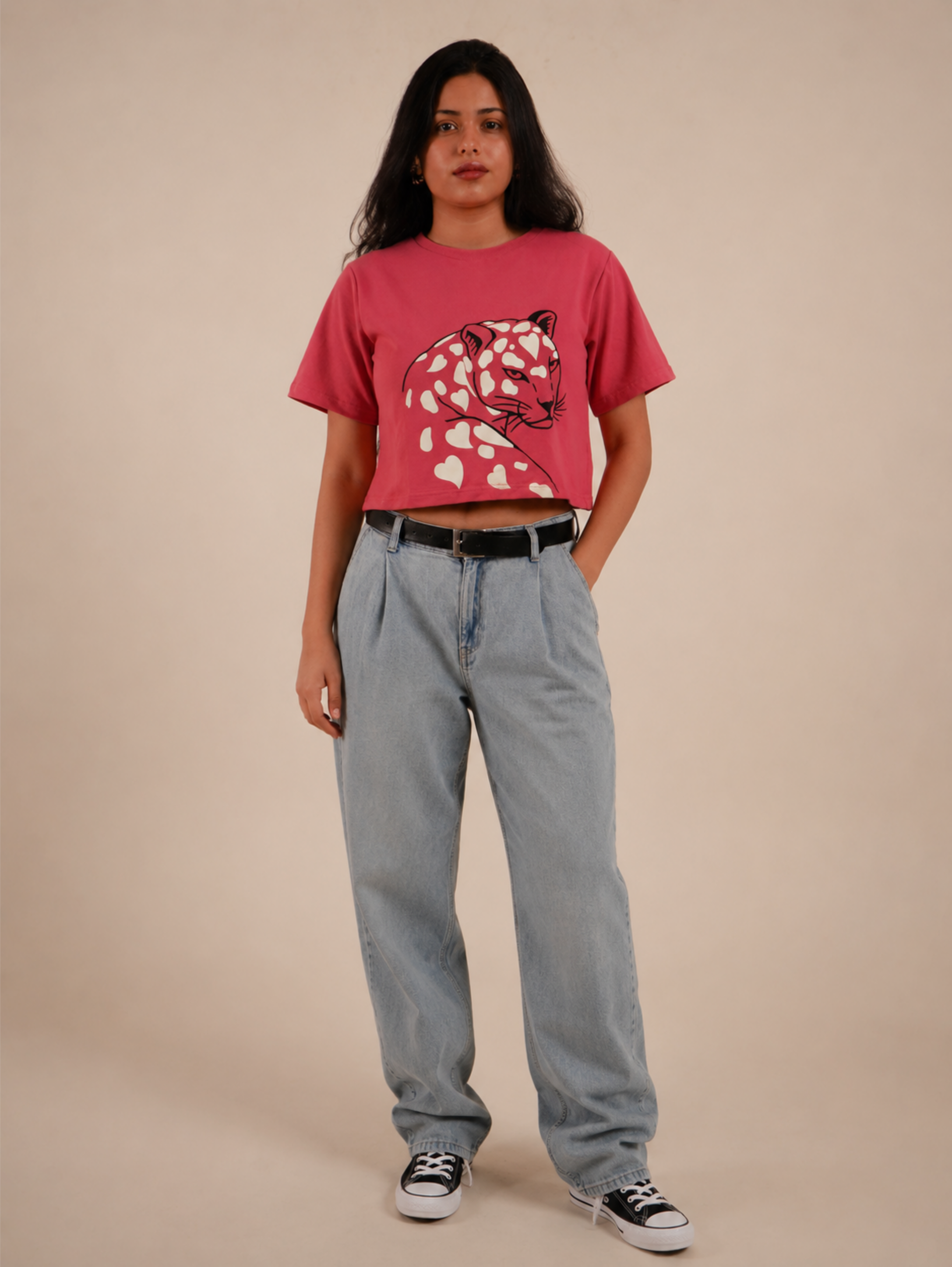 Female model styling Wild Romance premium rose pink crop top with light blue denim
