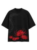 Silken Spine premium oversized black T-shirt by SYIN & SYRAH featuring an abstract spine graphic with vibrant red spider lily artwork on the front.