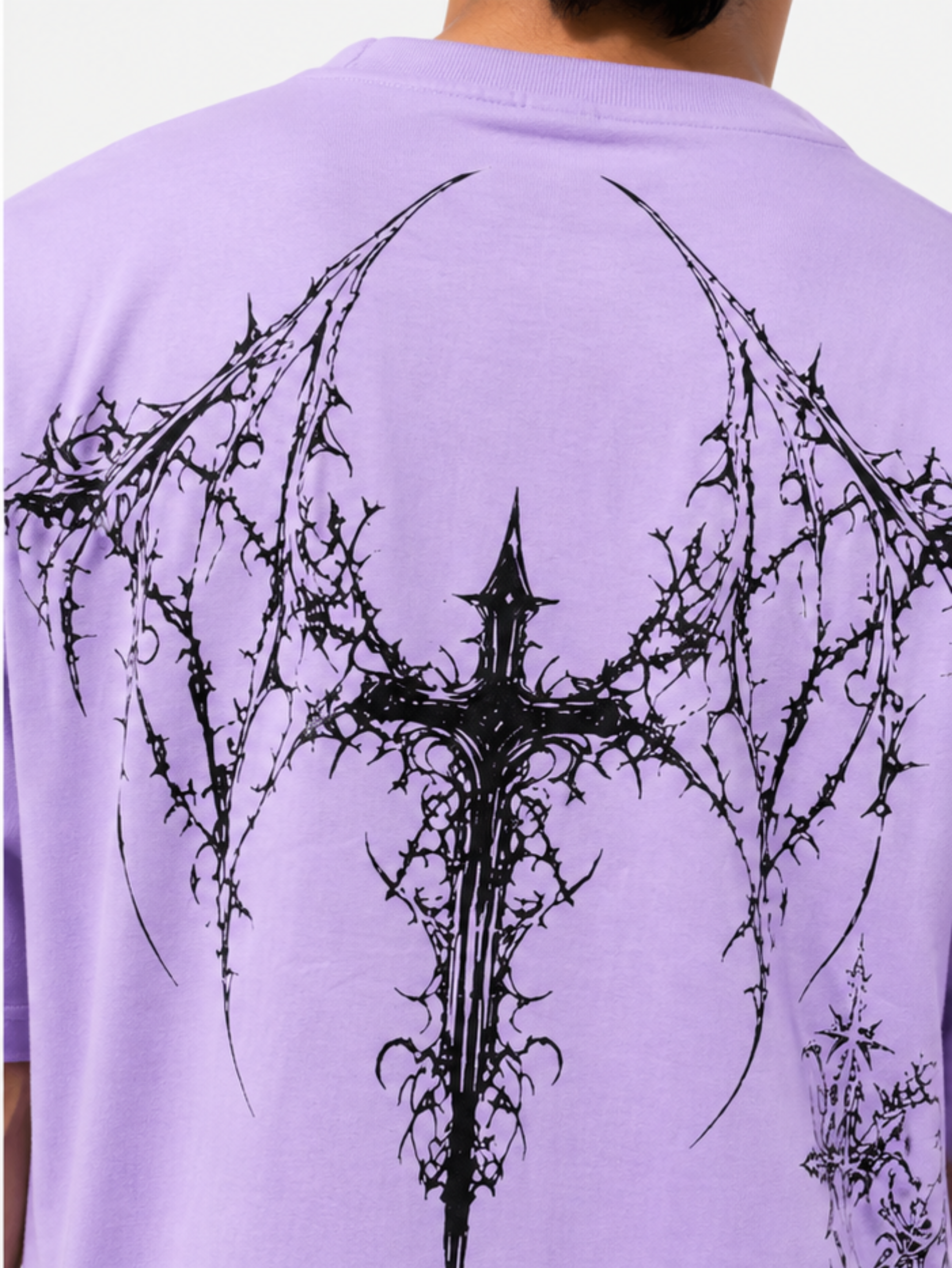 Back view of Thorned Oath oversized lavender t-shirt with large gothic wing graphic